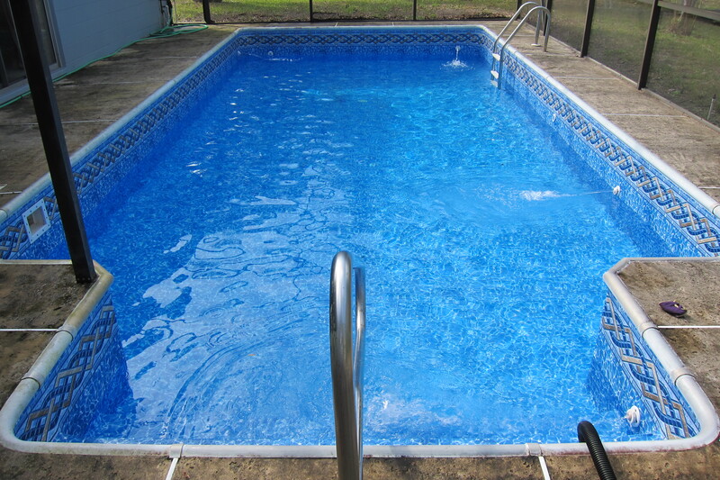 A Long Rectangle Pool With Clear Water in Blue
